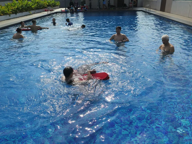 Lifeguard course trainees practising rescues in the pool