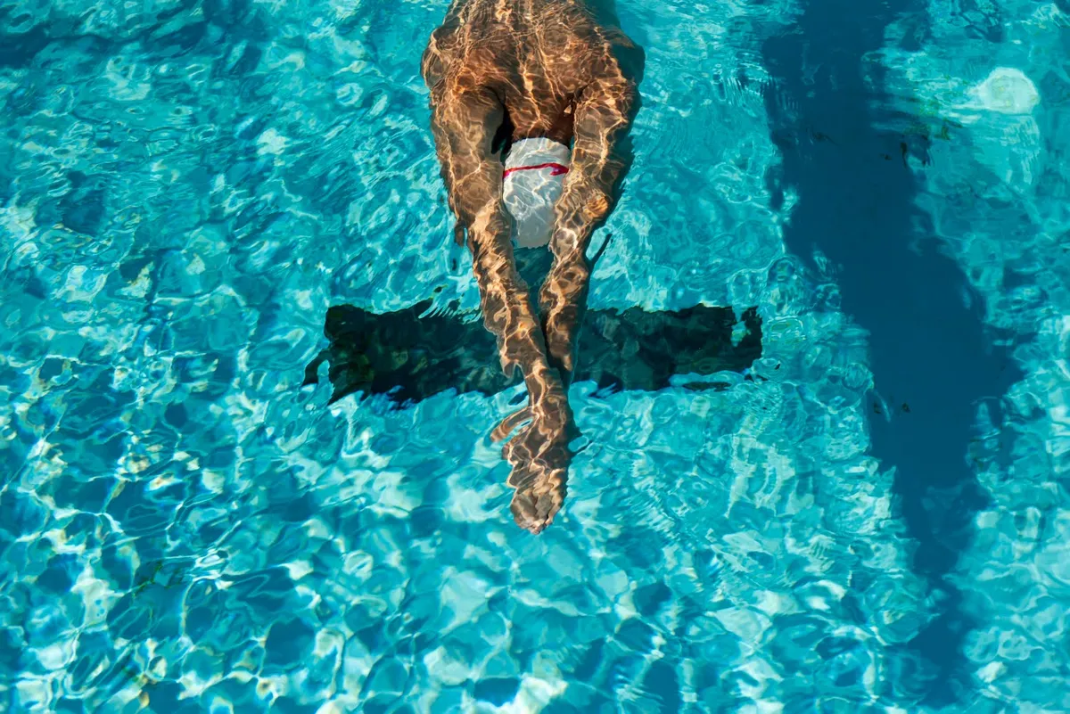 Swimmer doing freestyle, seen from above