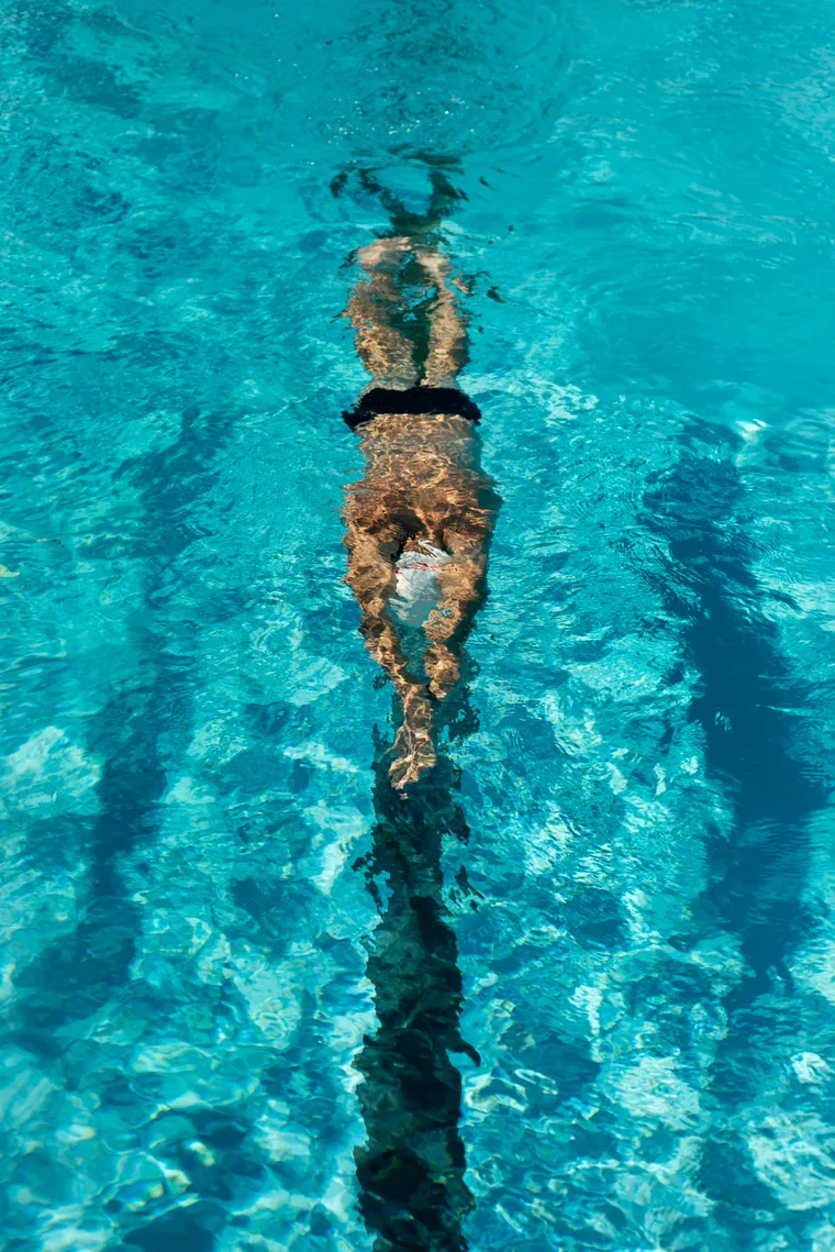 Swimmer doing freestyle, seen from above