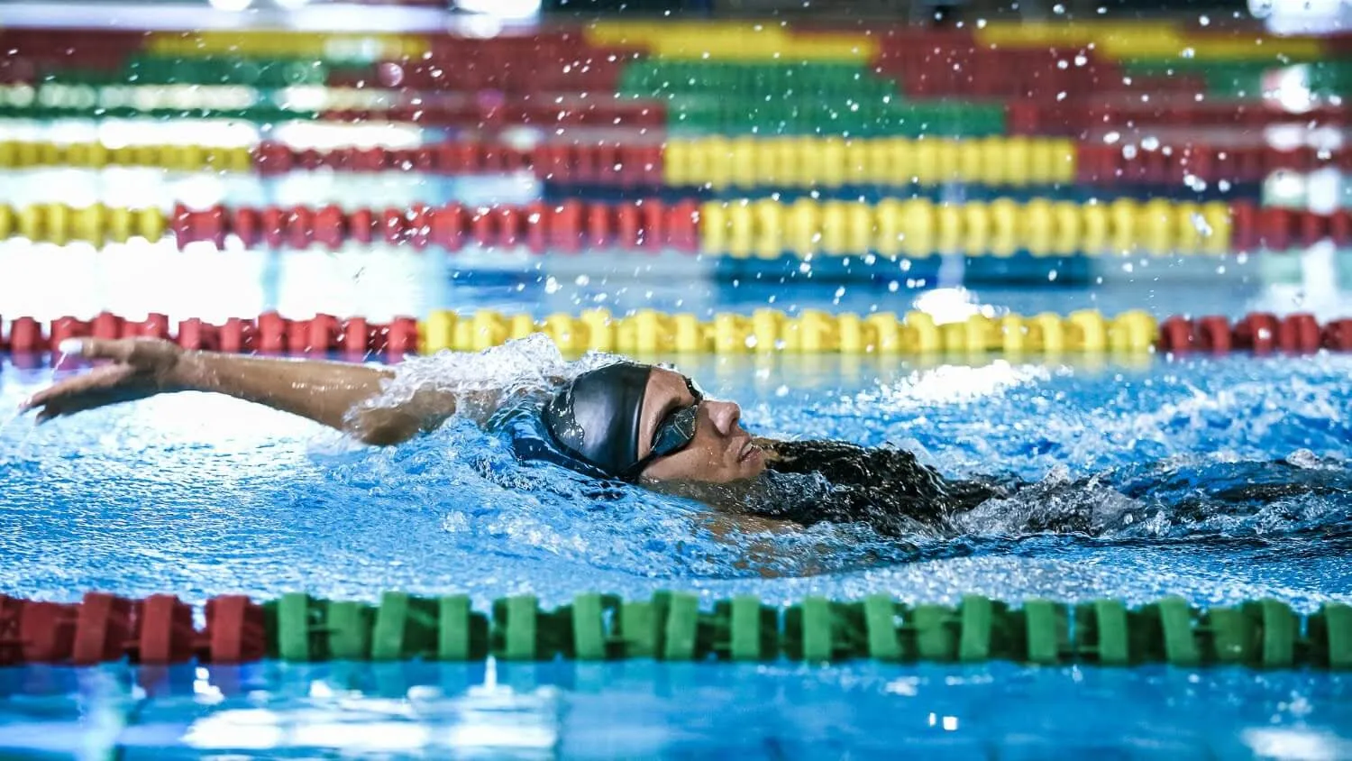 Swimmer doing freestyle with a flat body position