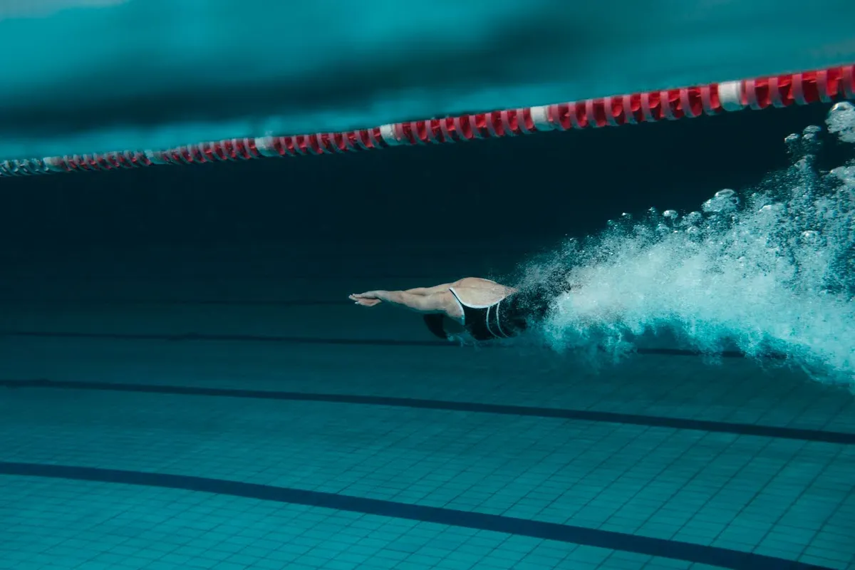 Swimmer sprinting freestyle underwater