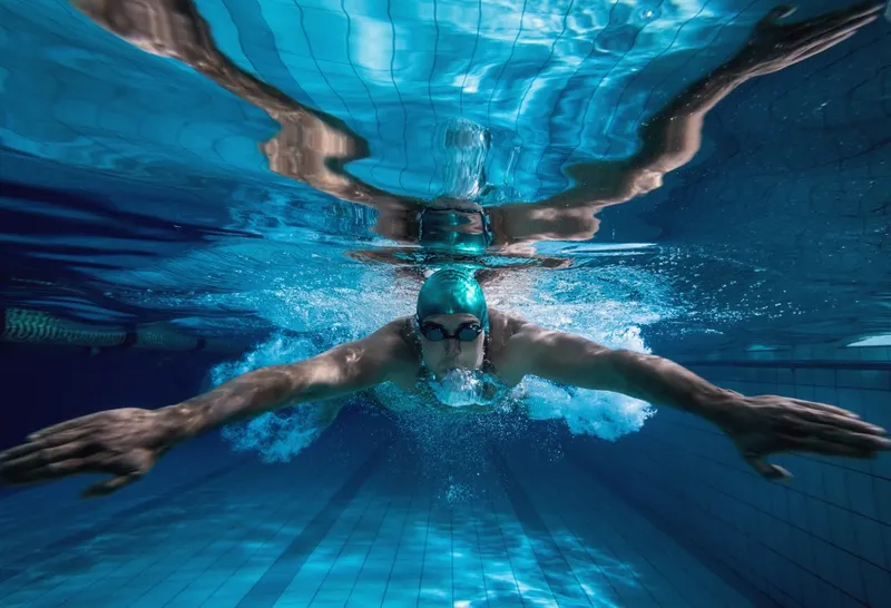 Swimmer doing freestyle, seen underwater