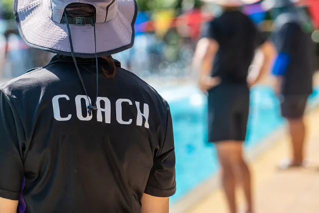 Swimming coach at the poolside