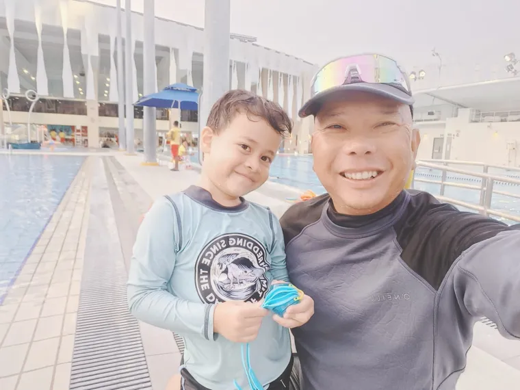 SwimSafe swimming coach and a boy student at the pool