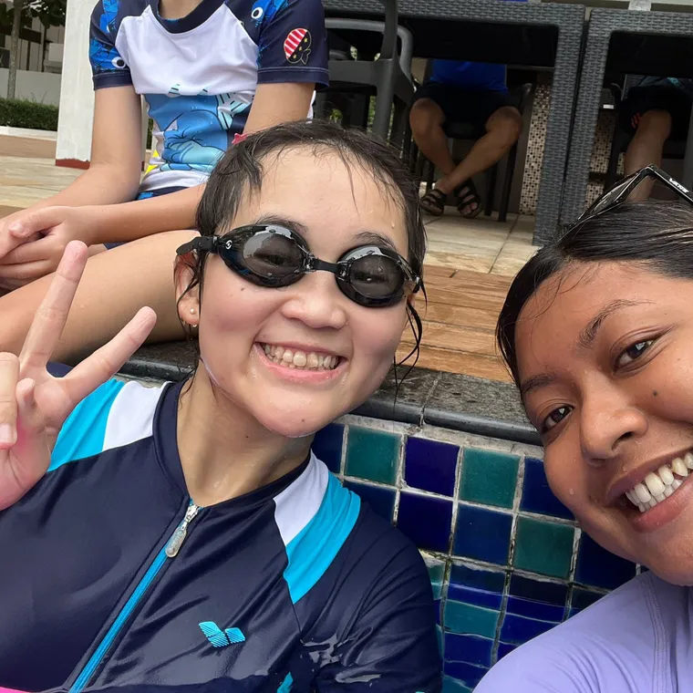 SwimSafe swimming coach and a girl student at the pool
