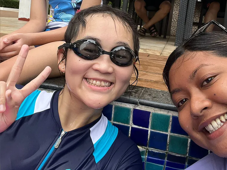 SwimSafe swimming coach and a smiling student at the pool