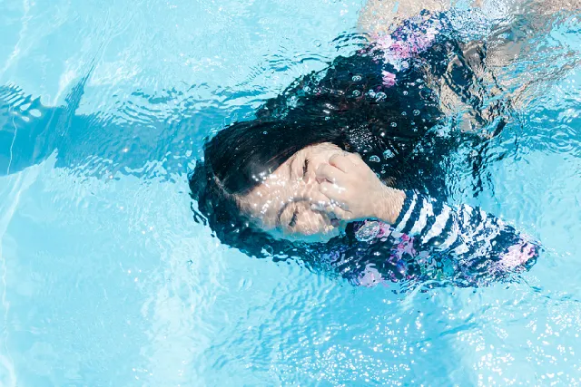 Woman practising breath control underwater