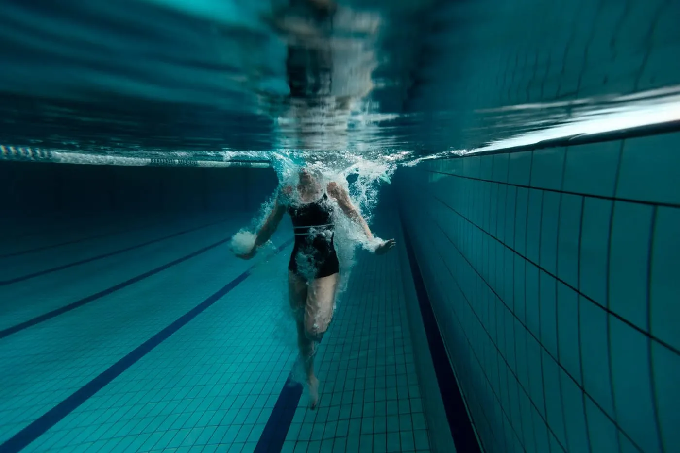 Woman sculling underwater